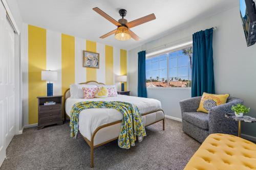 a bedroom with a bed and a chair at Resort-Style 5BR Heated Pool Putting Green in Glendale