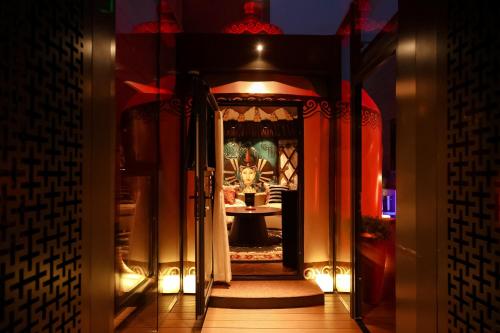 an entrance to a room with a table in a doorway at Mandarin Oriental Wangfujing, Beijing in Beijing