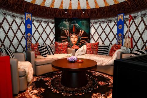 a living room with two couches and a table at Mandarin Oriental Wangfujing, Beijing in Beijing