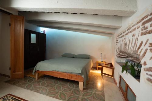 a bedroom with a bed in a room at Domus Santa Barbara Apartments with Pool in Santo Domingo