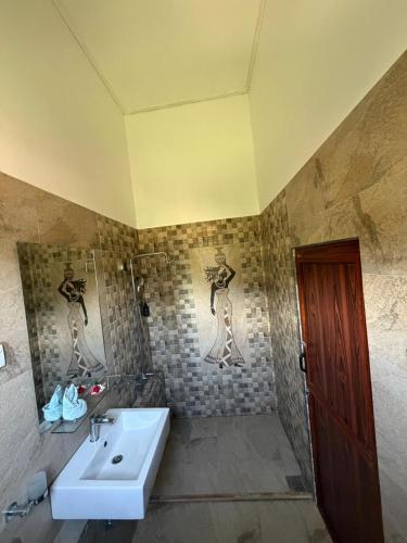 a bathroom with a sink and a shower at Riverston Hideaway in Matale