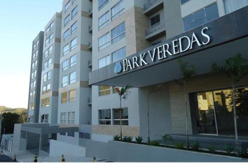 a building with a sign on the front of it at Flat Aconchegante - Park Veredas 417 in Rio Quente
