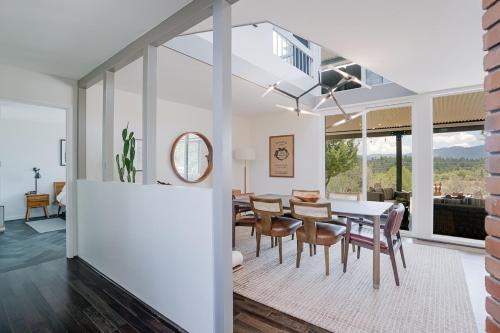 a dining room and living room with a table and chairs at Prescott Mountain Luxury Escape! in Prescott