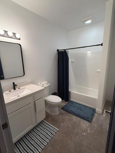 a bathroom with a sink and a toilet and a shower at Cedar Studios at Whitetail Estates in Babbitt