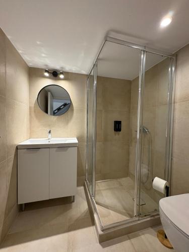 a bathroom with a shower and a sink and a toilet at Tailor Urban Loft Thiva in Thiva