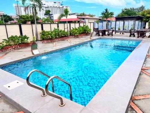 a swimming pool at a hotel at The Dhania Cenang Beach Langkawi in Pantai Cenang