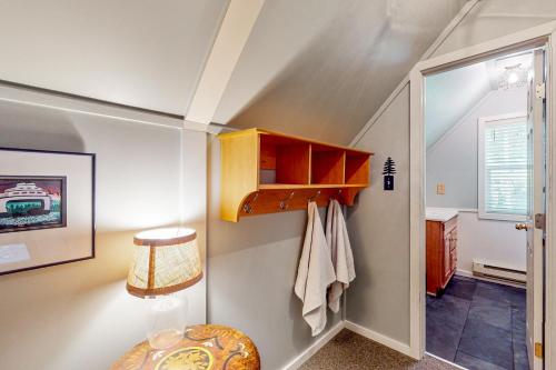 a small bathroom with a staircase with a closet at Wooded-View Decks: Family Cabin Retreat in Deming in Warnick