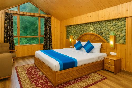 a bedroom with a bed in a room at The Raarees Mist Resort, Munnar - Nested in Nature's Lap in Munnar