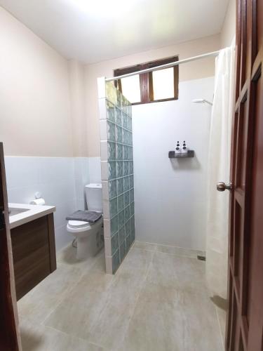 a bathroom with a toilet and a sink and a shower at Wichouda Cottage - Self Check-in in Chiang Dao