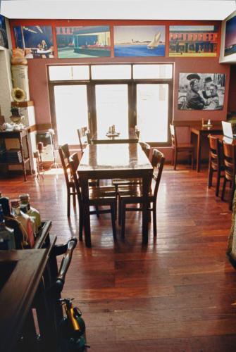 a dining room with a table and some chairs at Rendezvous Hostal in La Paz