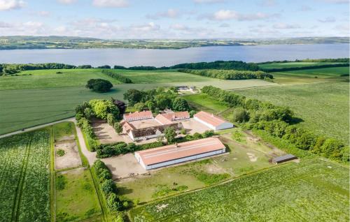 an aerial view of a house with a large building at 2 Bedroom Nice Apartment In Skanderborg in Skanderborg