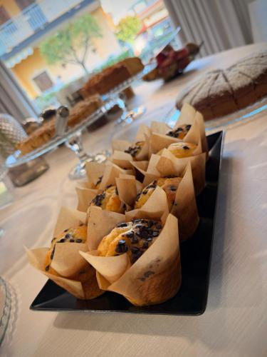a plate of pastries sitting on a table at Hotel Le Ceramiche in Montalto Uffugo
