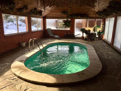 a swimming pool in the middle of a house at Arcadia in Kharkiv