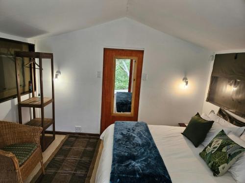 a bedroom with a bed and a ladder and a window at The Lineage Lodge in Elgin