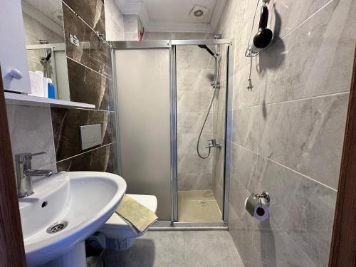 a bathroom with a shower and a sink at Biter Hotel in Istanbul