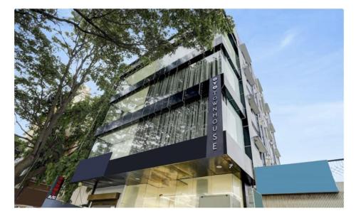 a tall building with a sign on the side of it at RLV green palace in Bangalore