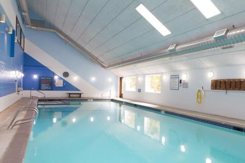 a large indoor swimming pool in a building at Snowater Respite in Glacier
