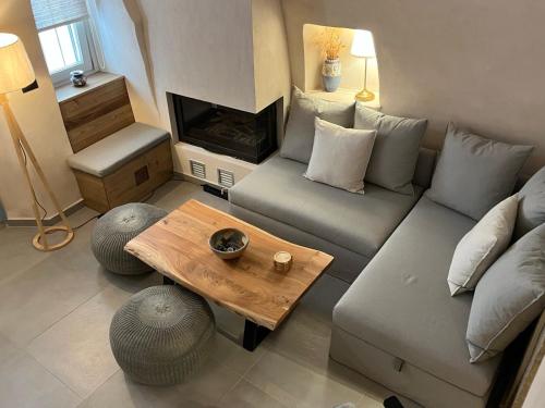 a living room with a couch and a coffee table at Patossa in Chios