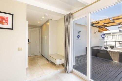 a bathroom with a bath tub and a window at Reo Hotel in Antalya