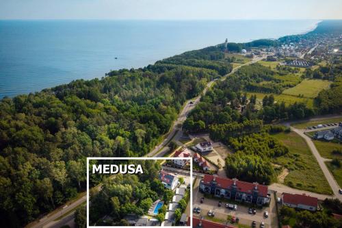 an aerial view of a town and the water at MEDUSA apartamenty i bungalowy in Niechorze