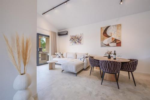 a living room with a couch and a table at House 61 in Milotski Breg