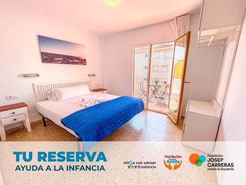 a bedroom with a bed and a balcony at Apartment Escor 3000 in Segur de Calafell