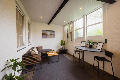 a living room with a couch and a table at HYGGE HOMES - Apartment 'gamleby' in Lüneburg