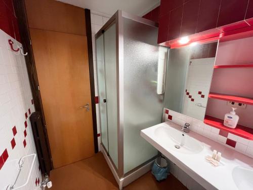 a bathroom with a sink and a shower with a mirror at Monterosa Paradise in Gressoney-la-Trinité