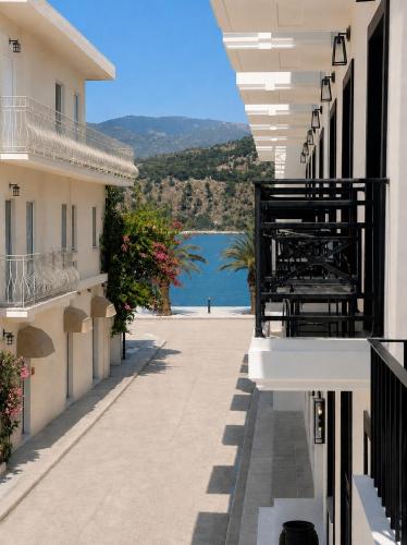 a balcony of a building with a view of the water at Anoi Kefalonia in Argostoli