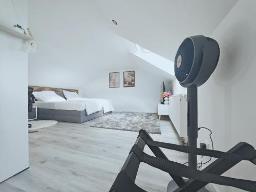 a bedroom with a bed and a speaker in a room at Unterkunft in Eggenfelden in Eggenfelden