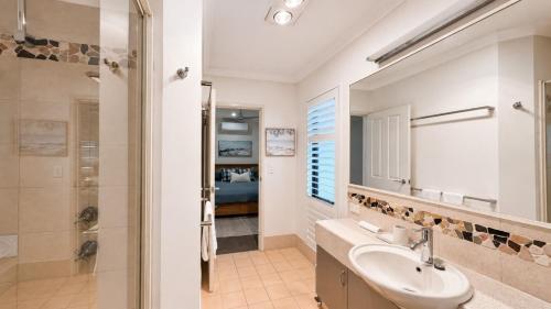 a bathroom with a sink and a shower at Saltwater Stay in Bunbury