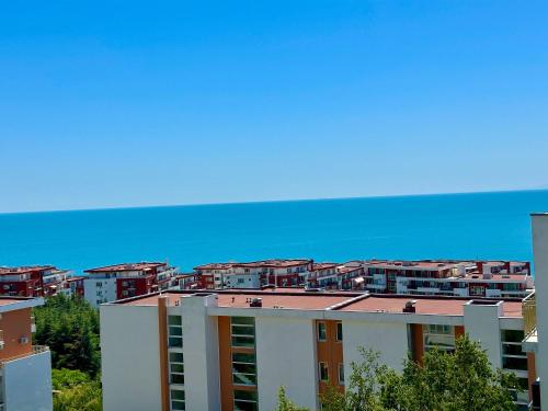 a view of a building with buildings in the background at Cozy Corner Studio in Crown Fort in Sveti Vlas