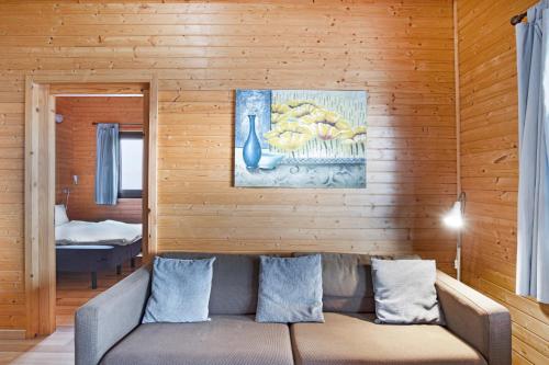 a living room with a couch and a painting on the wall at Moijama 12 in Los Llanos de Aridane