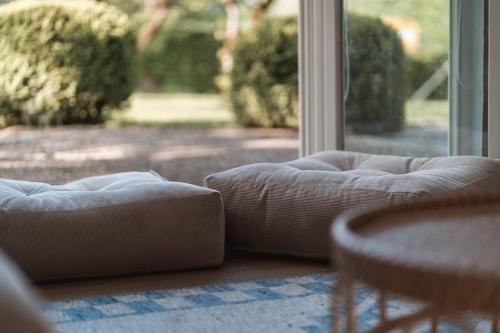 a living room with a couch and a window at Apartment Søglas in Gmund am Tegernsee