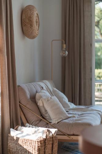 a bed sitting in a room next to a window at Apartment Søglas in Gmund am Tegernsee