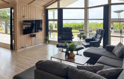 a living room with couches and chairs and a television at Awesome Home In Gørlev With Wifi in Gørlev