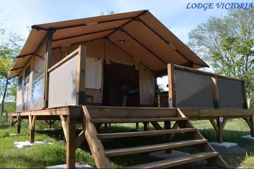 a house with a picnic table in front of it at Domaine de Montaut in Montaut-Ariège