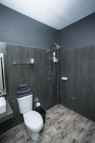 a bathroom with a toilet and a shower at Sandana Studio Apartments - Studio 2 in Nathon Bay