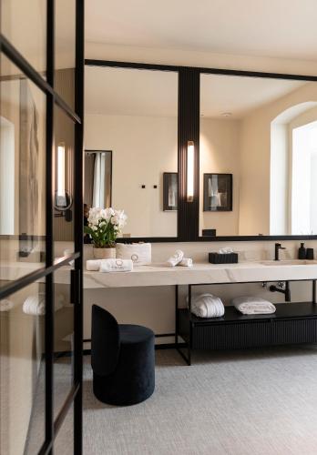 a bathroom with a sink and a mirror at Sparano Palace - Luxury Maison in Bari