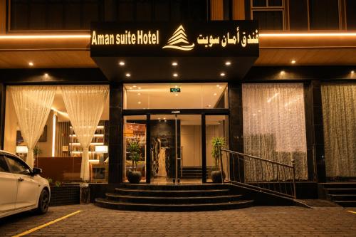 a building with a car parked in front of it at فندق امان أبها - المعالي in Abha