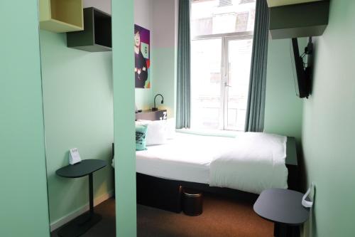a room with a bed and a window at Garner Hotel Dublin Temple Bar by IHG in Dublin