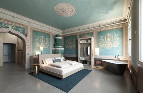 a living room with a bed and a bath tub at Langenmantel Historic Suites in Termeno