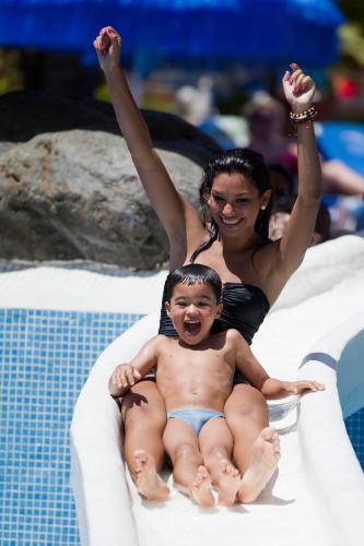 a woman and a child sitting in a pool at Mirador Maspalomas by Dunas in Maspalomas
