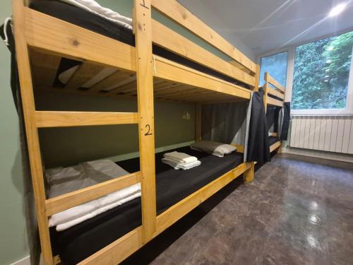 a bunk bed room with two bunk beds in it at Balea Hostel in San Sebastián