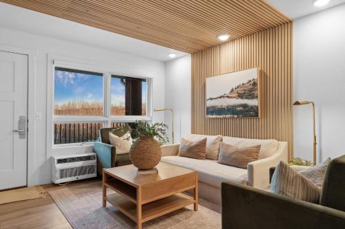 a living room with a couch and a table at RC403A- The Landing Lookout condo in Branson