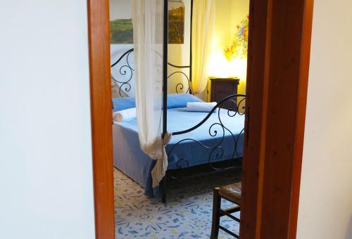 Un pat sau paturi într-o cameră la Lisola Residence