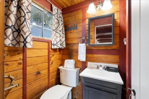 a bathroom with a toilet and a sink at Waterfront w/ Prvt Dock & Firepit | Sleeps 8 in Acton