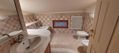 a bathroom with a sink and a toilet at Appartamento "Sul Corso" Atessa in Atessa