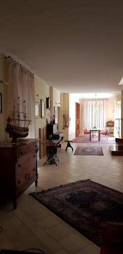a large living room with a couch and a table at Appartamento "Sul Corso" Atessa in Atessa