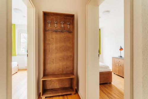a hallway with a wooden door in a house at Bodeapartment 3 in Elend
